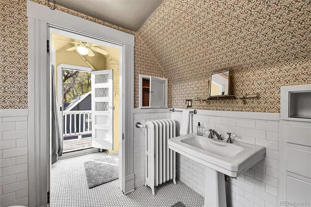 a bathroom with a sink a mirror and a bathtub