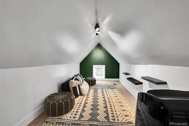 a bed room with a bed and a television