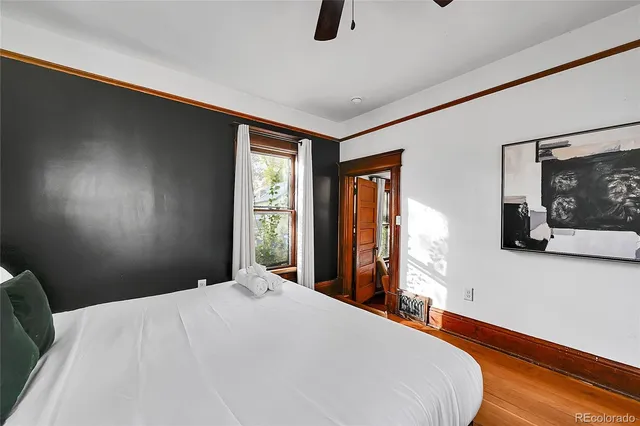 a bedroom with a bed and window