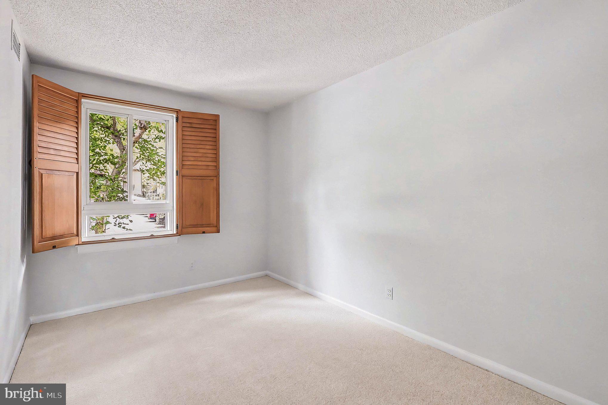 2247 Castle Rock Square, Unit 12C Reston, VA 20191 - Photo 12 of 23 Bright and airy room with window view.