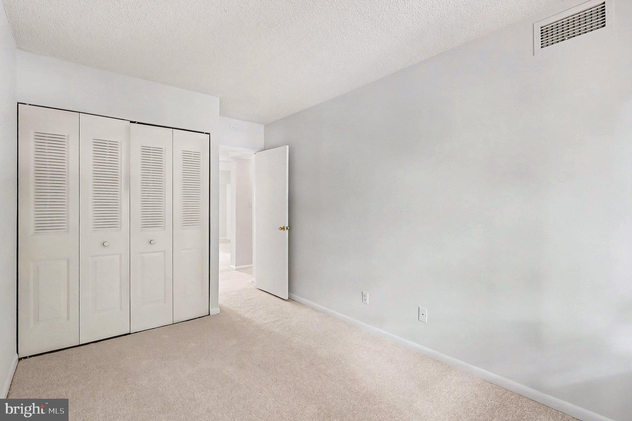 2247 Castle Rock Square, Unit 12C Reston, VA 20191 - Photo 13 of 23 Bright and airy bedroom retreat.