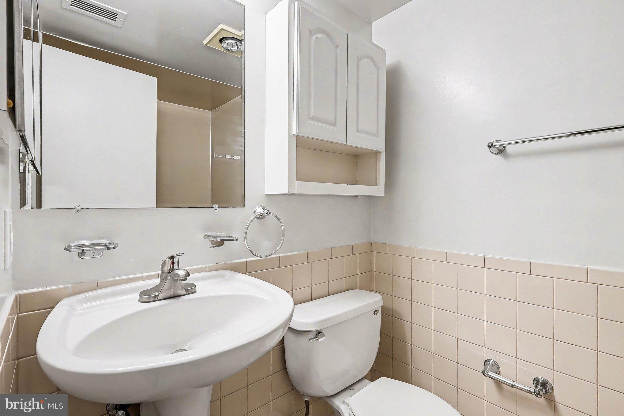2247 Castle Rock Square, Unit 12C Reston, VA 20191 - Photo 16 of 23 Modern bathroom with sleek finishes.