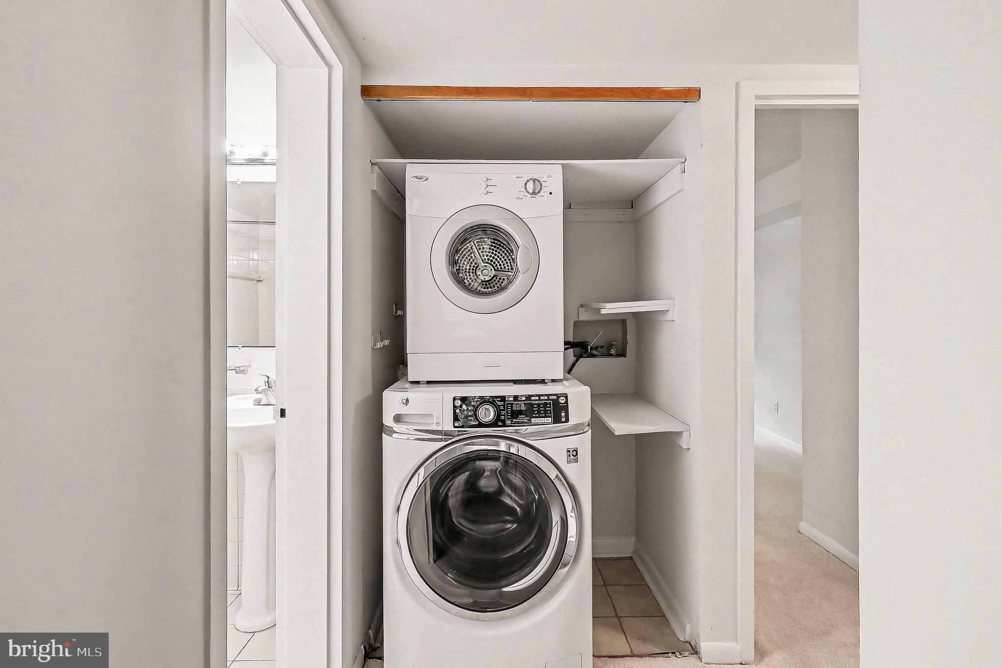 2247 Castle Rock Square, Unit 12C Reston, VA 20191 - Photo 18 of 23 Efficient laundry nook in modern design.