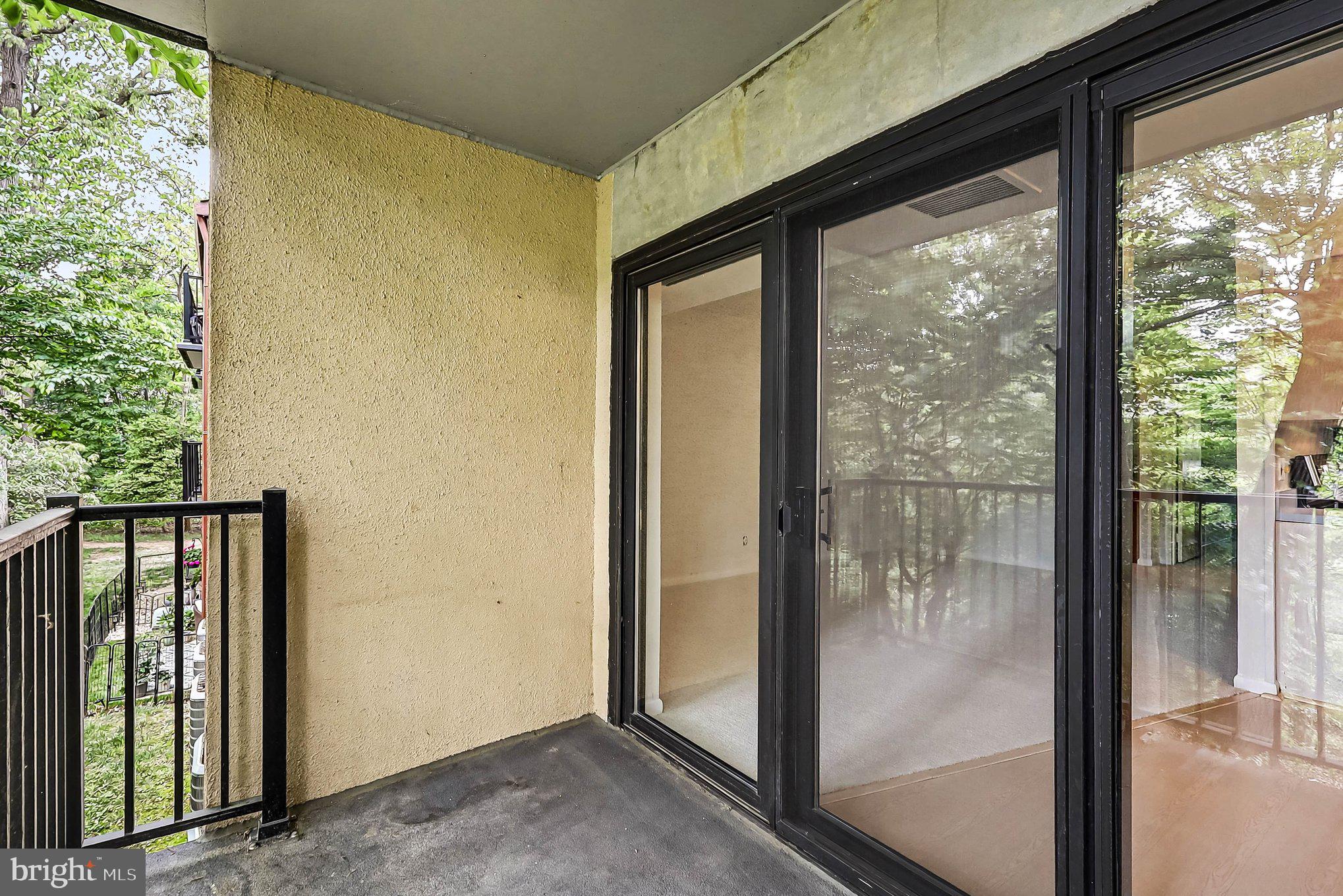 2247 Castle Rock Square, Unit 12C Reston, VA 20191 - Photo 21 of 23 Serene balcony with lush views.