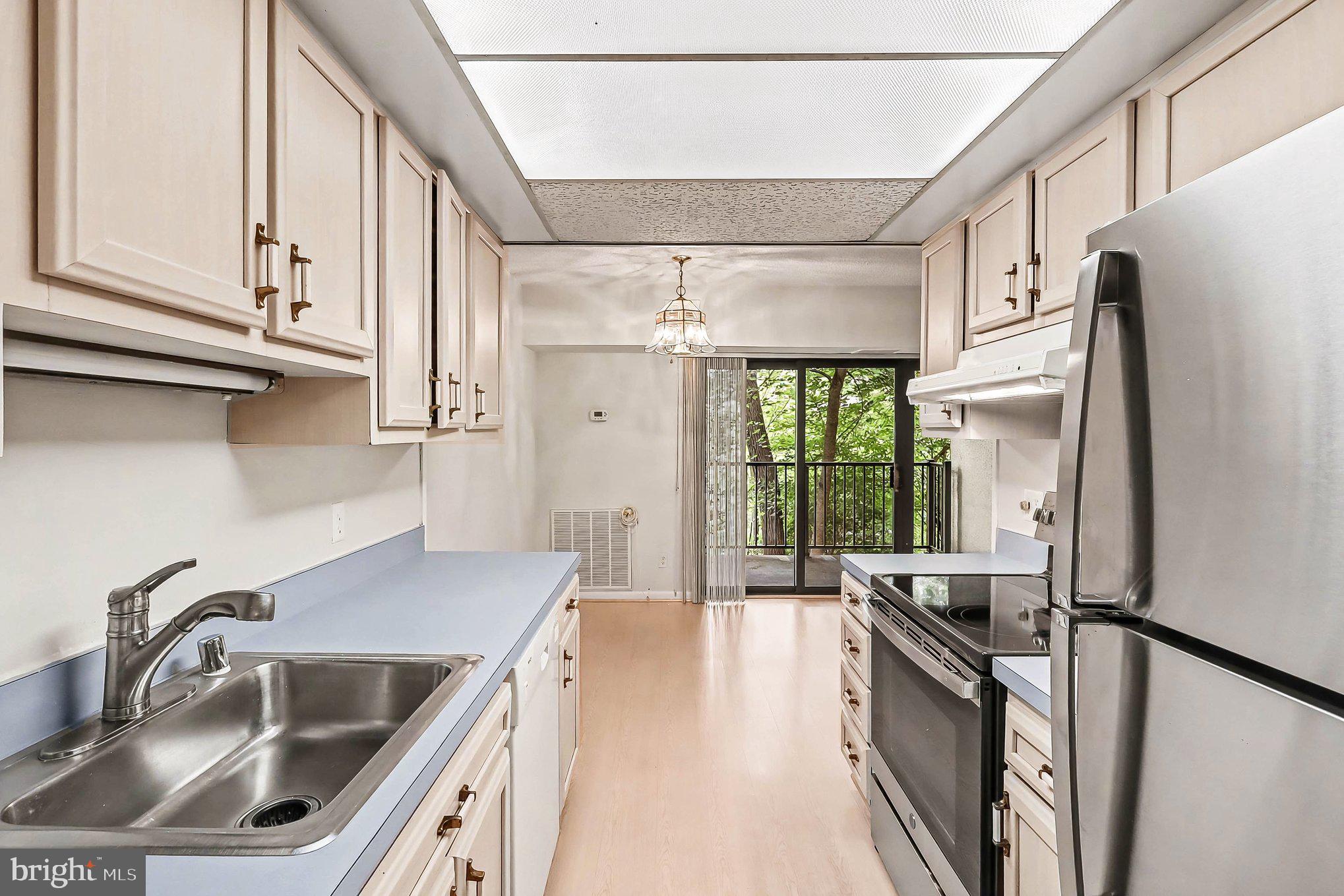 2247 Castle Rock Square, Unit 12C Reston, VA 20191 - Photo 6 of 23 Bright and airy kitchen with views.