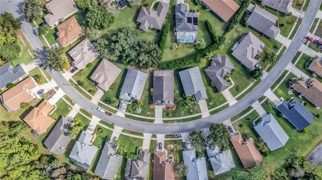 an aerial view of a houses with outdoor space