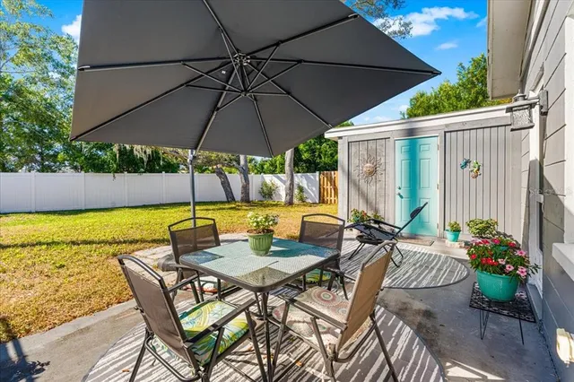 a view of an outdoor sitting area with swimming pool