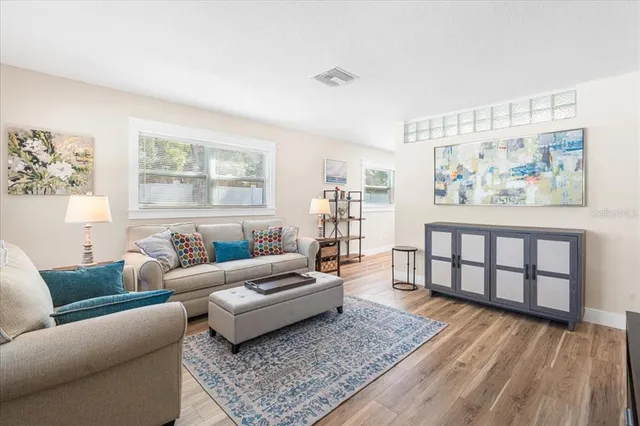 a living room with furniture and a rug