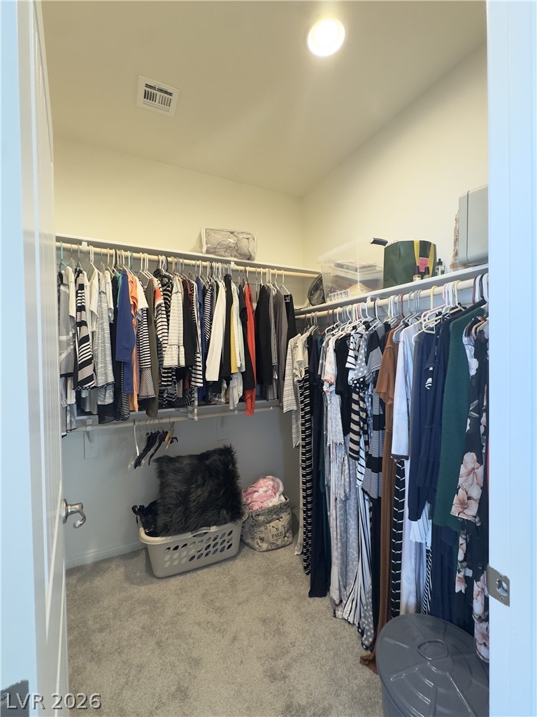 78 Summer Rhapsody Avenue Henderson, NV 89015 - Photo 22 of 31 Walk in closet with light colored carpet