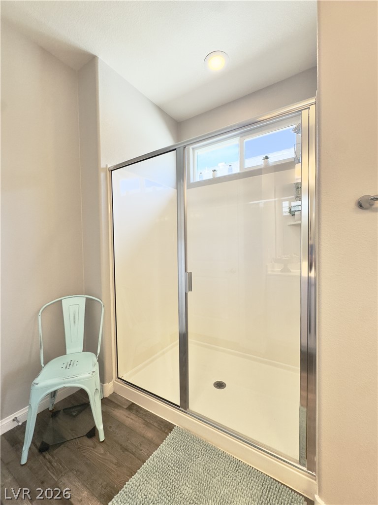 78 Summer Rhapsody Avenue Henderson, NV 89015 - Photo 25 of 31 Bathroom featuring dark wood-style floors and a stall shower