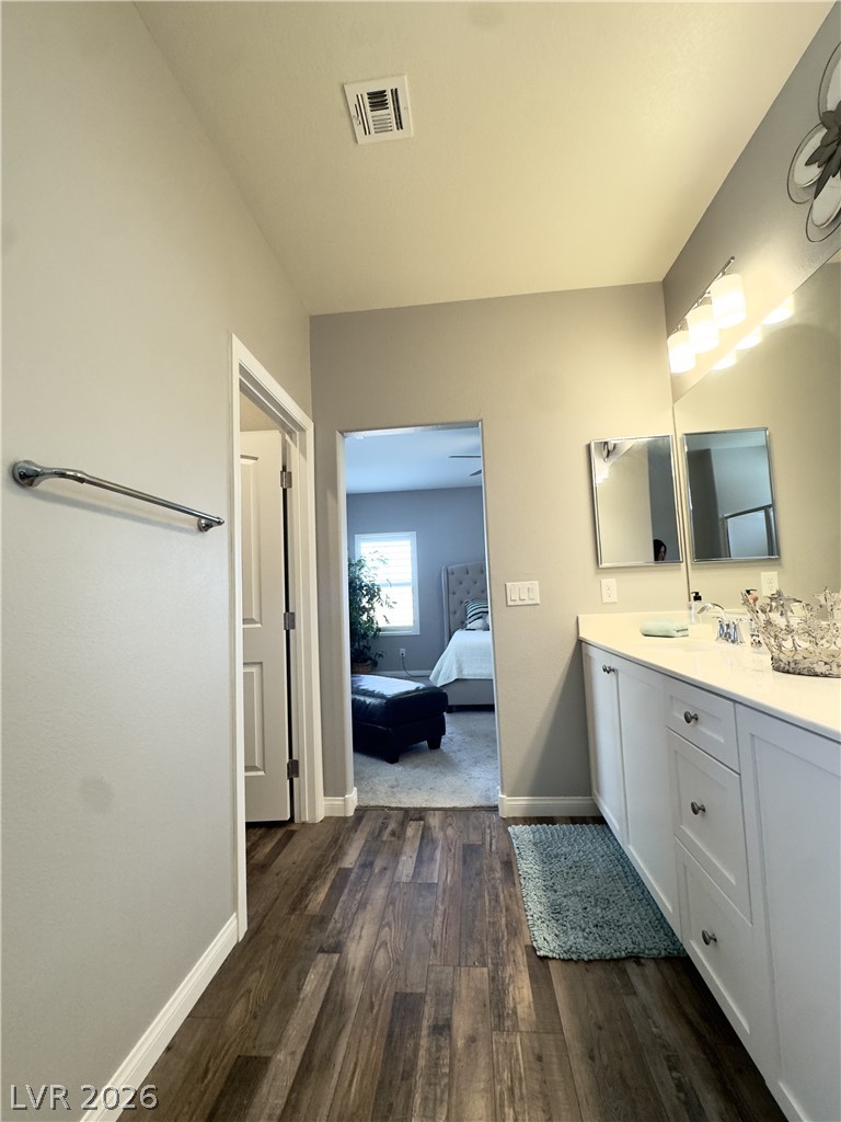 78 Summer Rhapsody Avenue Henderson, NV 89015 - Photo 26 of 31 Full bathroom featuring vanity, dark wood-type flooring, and ensuite bath