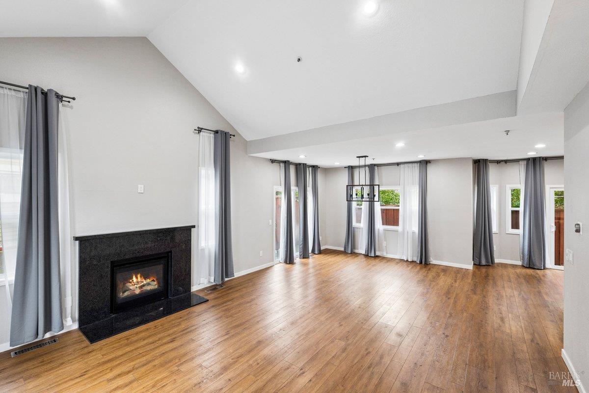 4 Courtney Lane Mill Valley, CA 94941 - Photo 2 of 14 a view of an empty room with wooden floor fireplace and a window