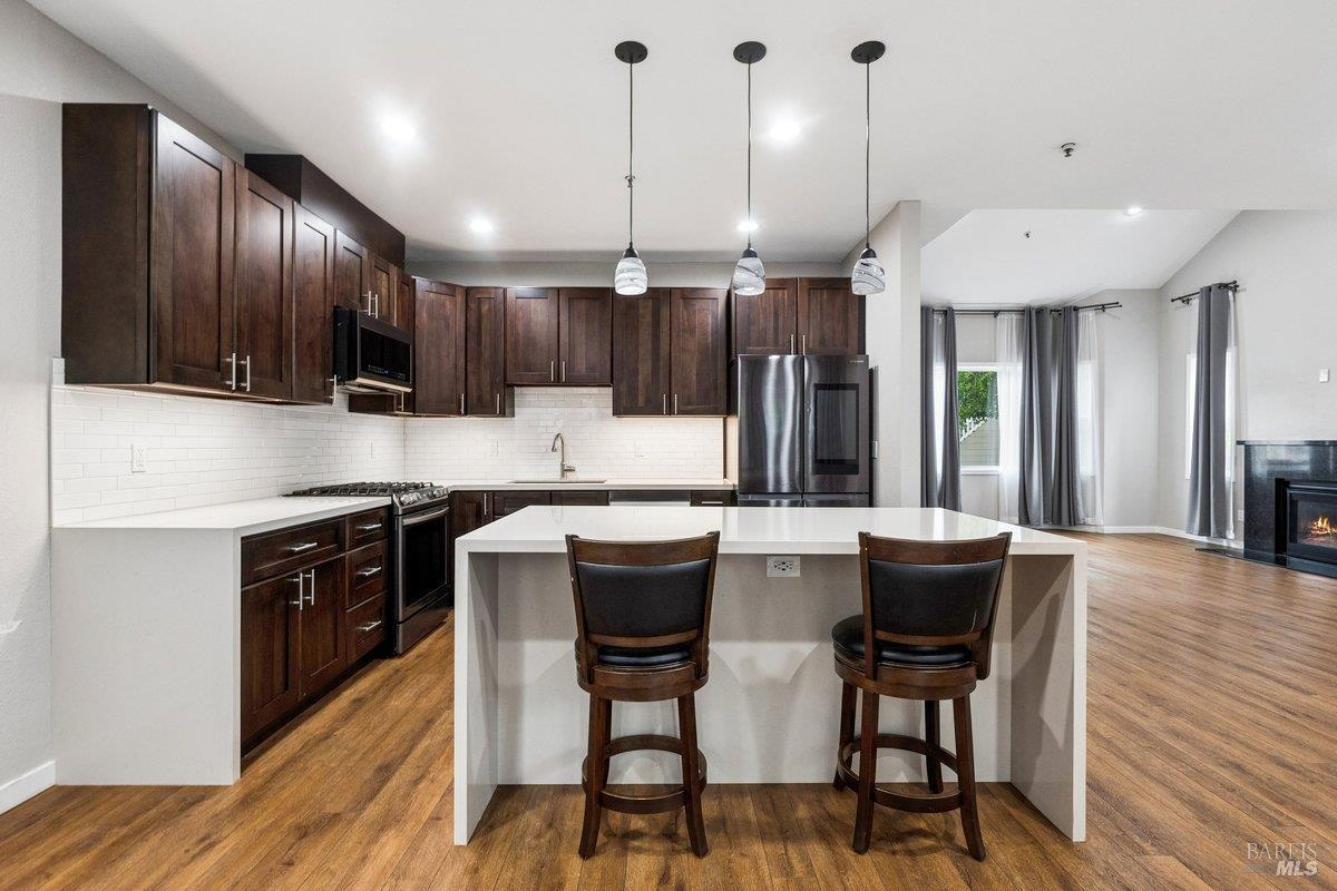4 Courtney Lane Mill Valley, CA 94941 - Photo 6 of 14 a kitchen with kitchen island granite countertop a sink and a stove