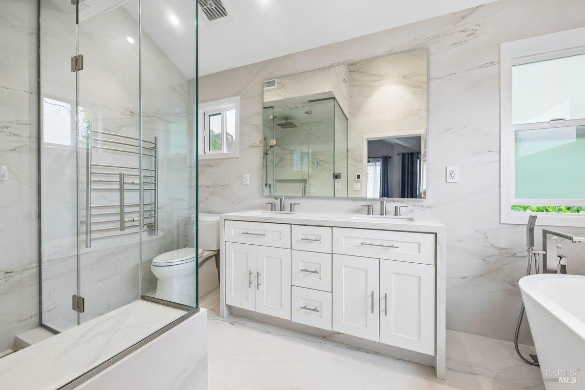 4 Courtney Lane Mill Valley, CA 94941 - Photo 8 of 14 a spacious bathroom with a double vanity sink a toilet a mirror and shower