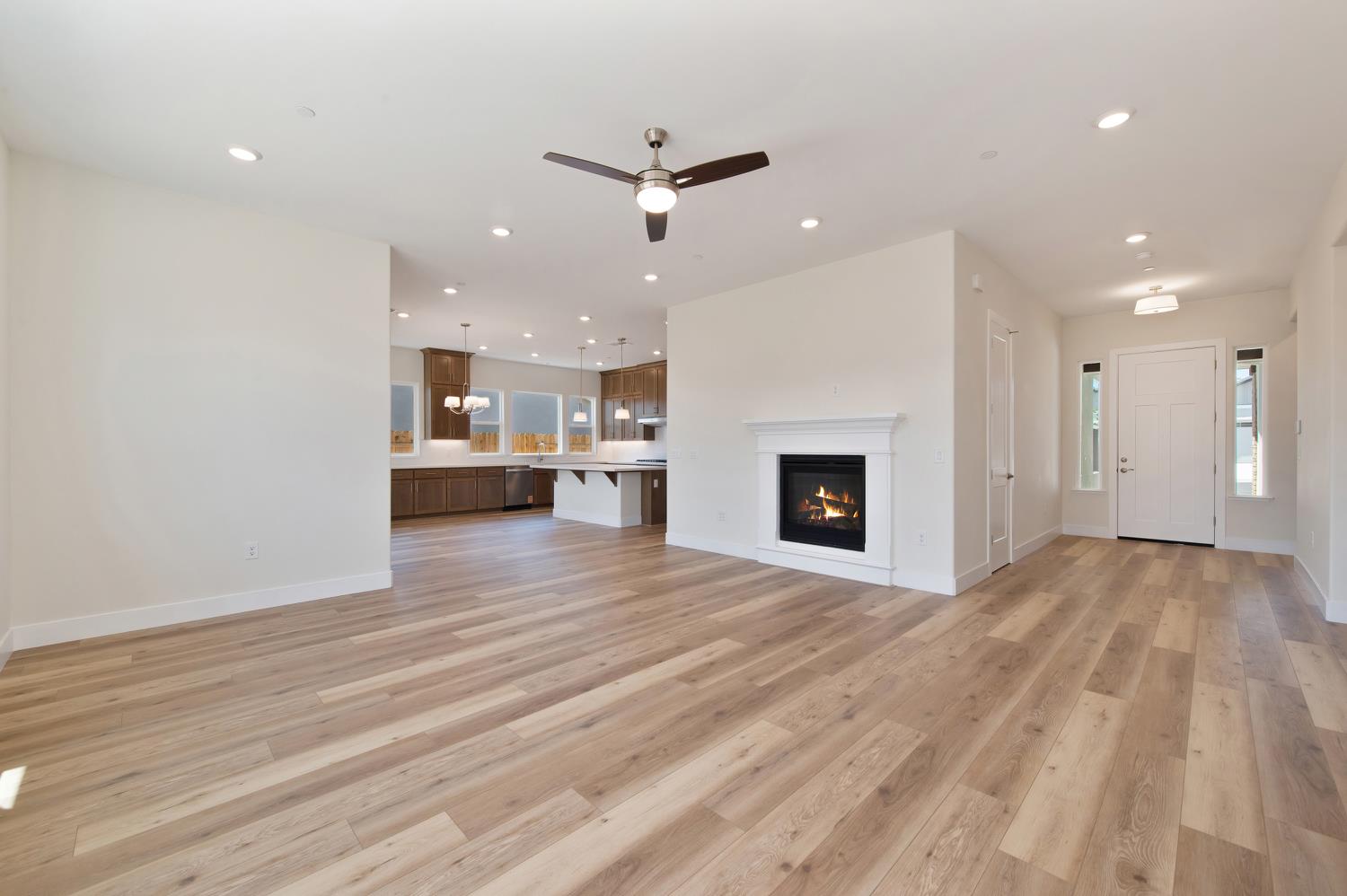 1207 Buck Ridge Drive Rocklin, CA 95765 - Photo 4 of 12 a view of a kitchen with a sink and a fireplace