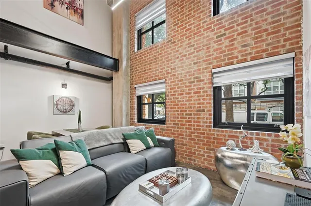 a living room with furniture and windows