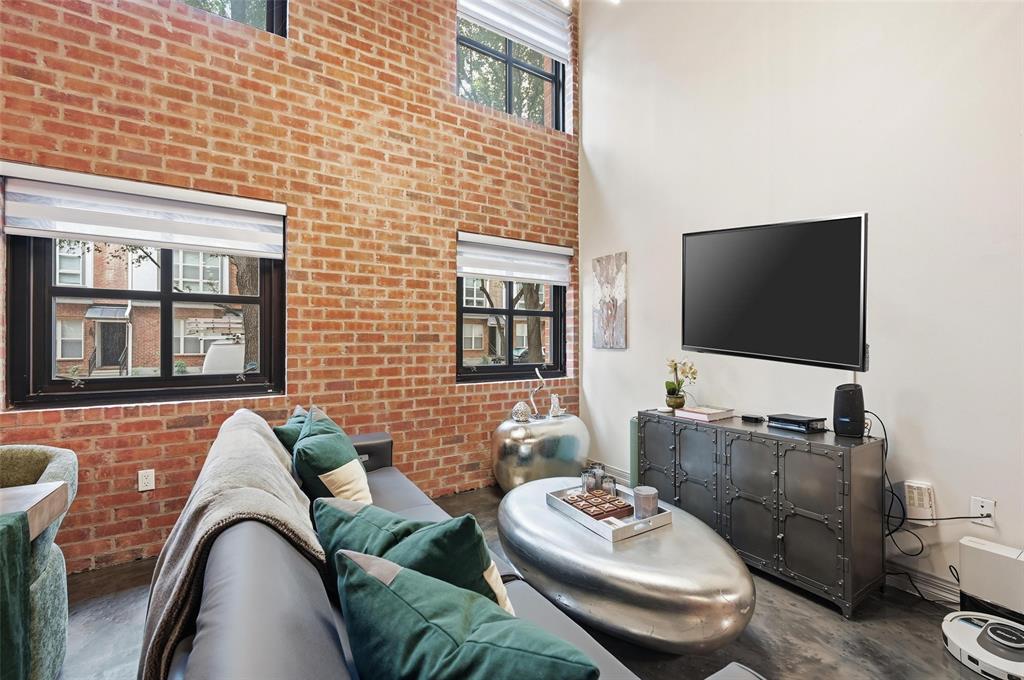 3110 Thomas Avenue, Unit 105 Dallas, TX 75204 - Photo 14 of 37 a living room with furniture and a flat screen tv