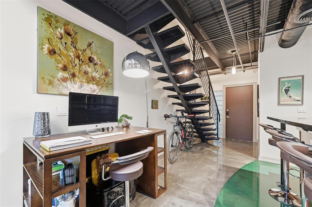 3110 Thomas Avenue, Unit 105 Dallas, TX 75204 - Photo 15 of 37 a view of a dining room with furniture and wooden floor
