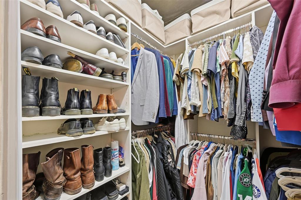 3110 Thomas Avenue, Unit 105 Dallas, TX 75204 - Photo 25 of 37 a view of walk in closet with clothes and shoes
