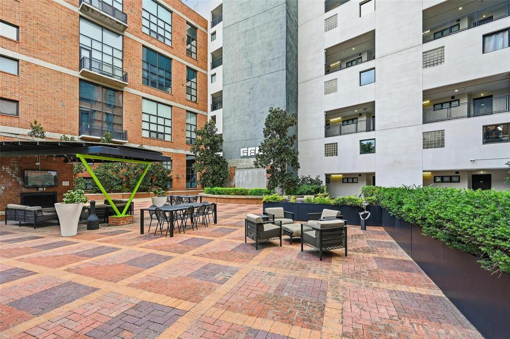 3110 Thomas Avenue, Unit 105 Dallas, TX 75204 - Photo 30 of 37 a view of a building with sitting area