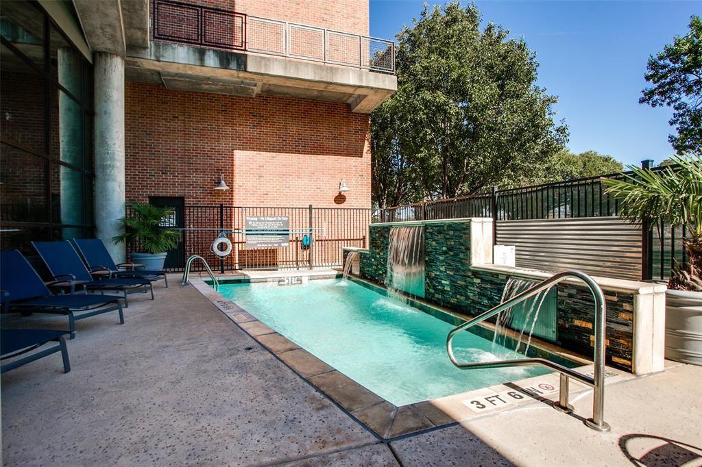 3110 Thomas Avenue, Unit 105 Dallas, TX 75204 - Photo 32 of 37 a view of backyard with swimming pool and outdoor seating