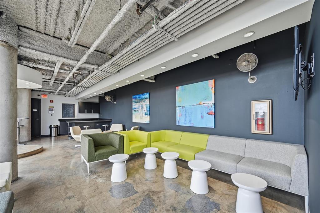 3110 Thomas Avenue, Unit 105 Dallas, TX 75204 - Photo 37 of 37 a living room with furniture and a clock