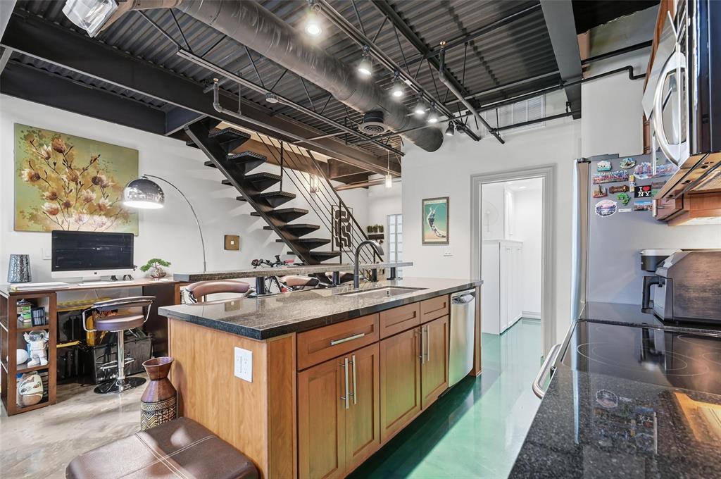 3110 Thomas Avenue, Unit 105 Dallas, TX 75204 - Photo 7 of 37 a kitchen with a stove and a refrigerator