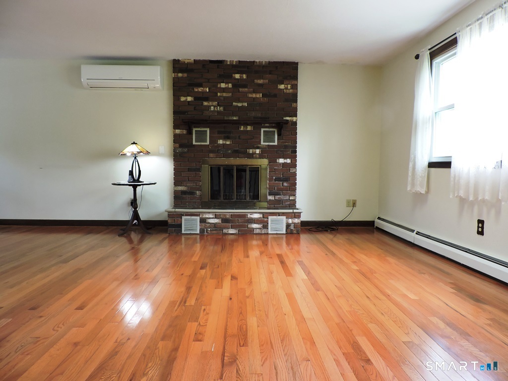 269 Griffin Road South Windsor, CT 06074 - Photo 11 of 36 a view of a room with wooden floor and window