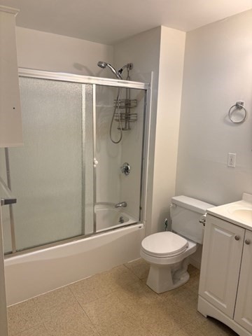 287 Rantoul Street, Unit 2L Beverly, MA 01915 - Photo 11 of 16 a bathroom with a toilet and shower