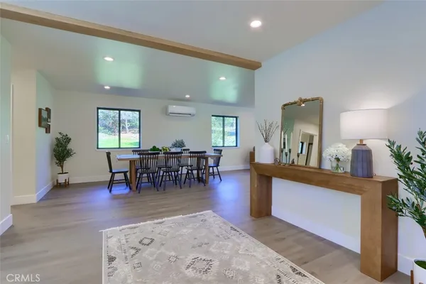 a dining room with furniture and window