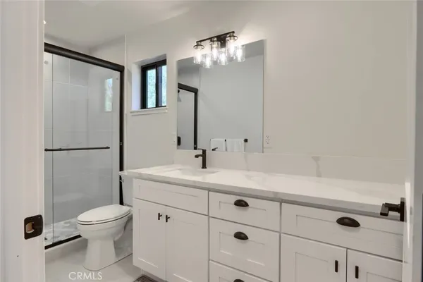 a bathroom with a shower and toilet