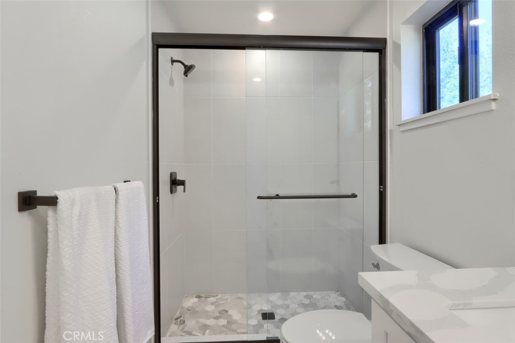 3181 B Triangle Park Road Mariposa, CA 95338 - Photo 15 of 44 a bathroom with a shower and toilet