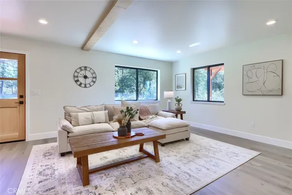 a living room with furniture and large window