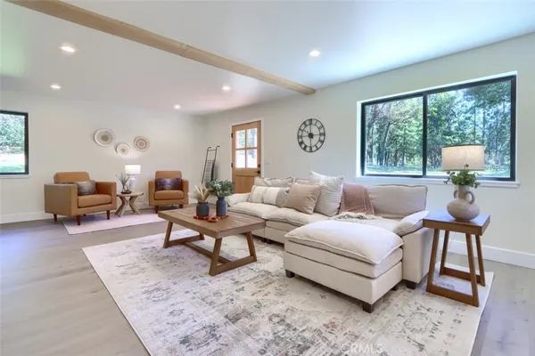 a living room with furniture and windows