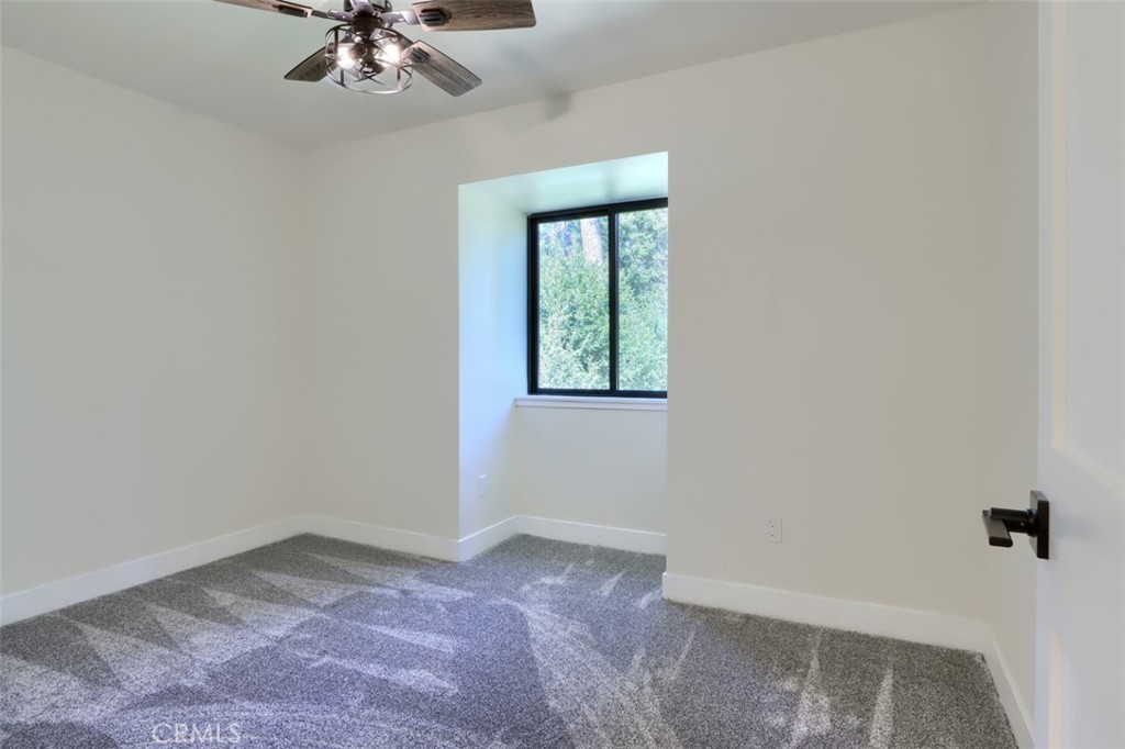 3181 B Triangle Park Road Mariposa, CA 95338 - Photo 27 of 44 an empty room with a window