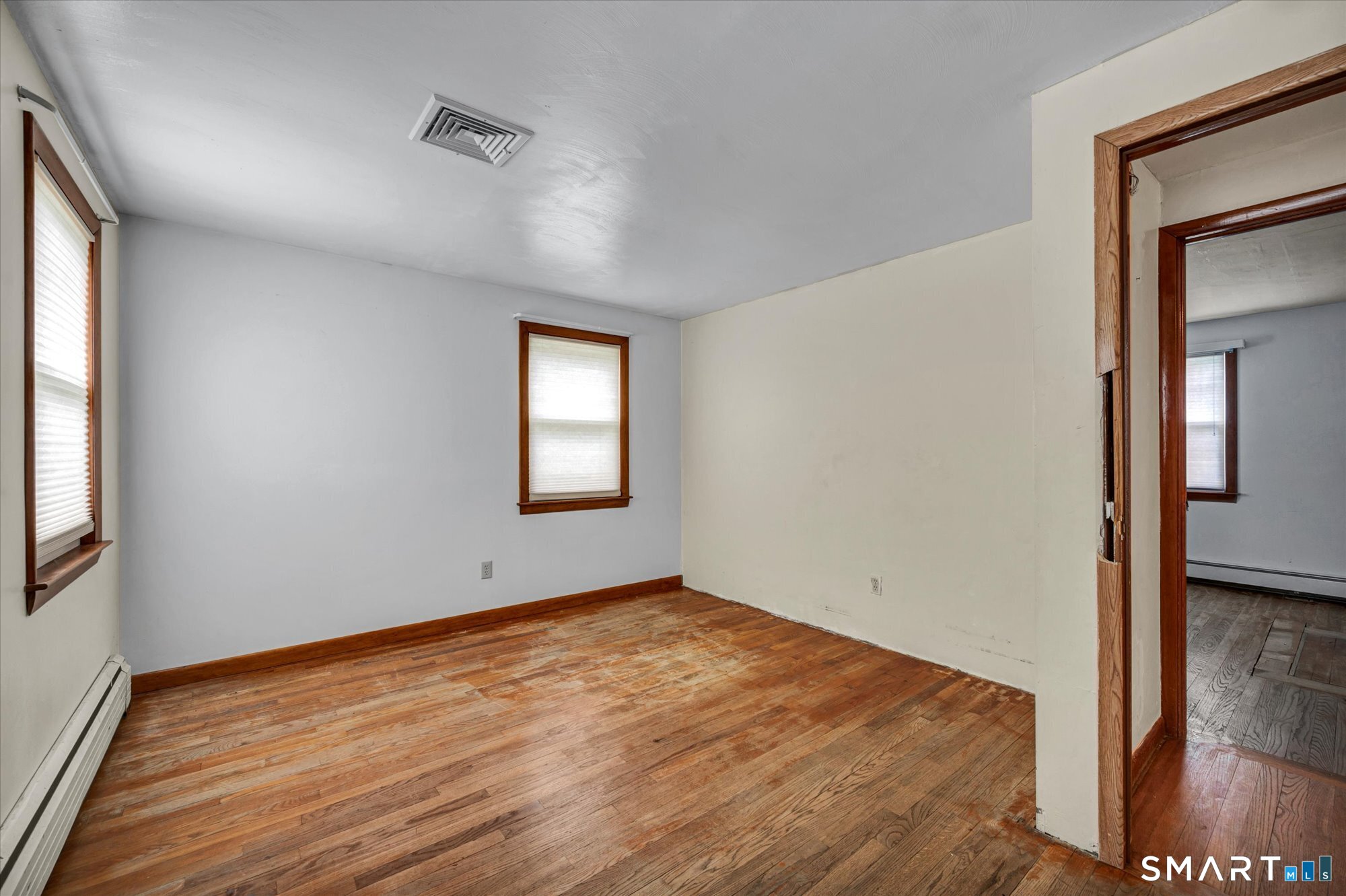 740 Rainbow Road Windsor, CT 06095 - Photo 23 of 40 an empty room with wooden floor and windows
