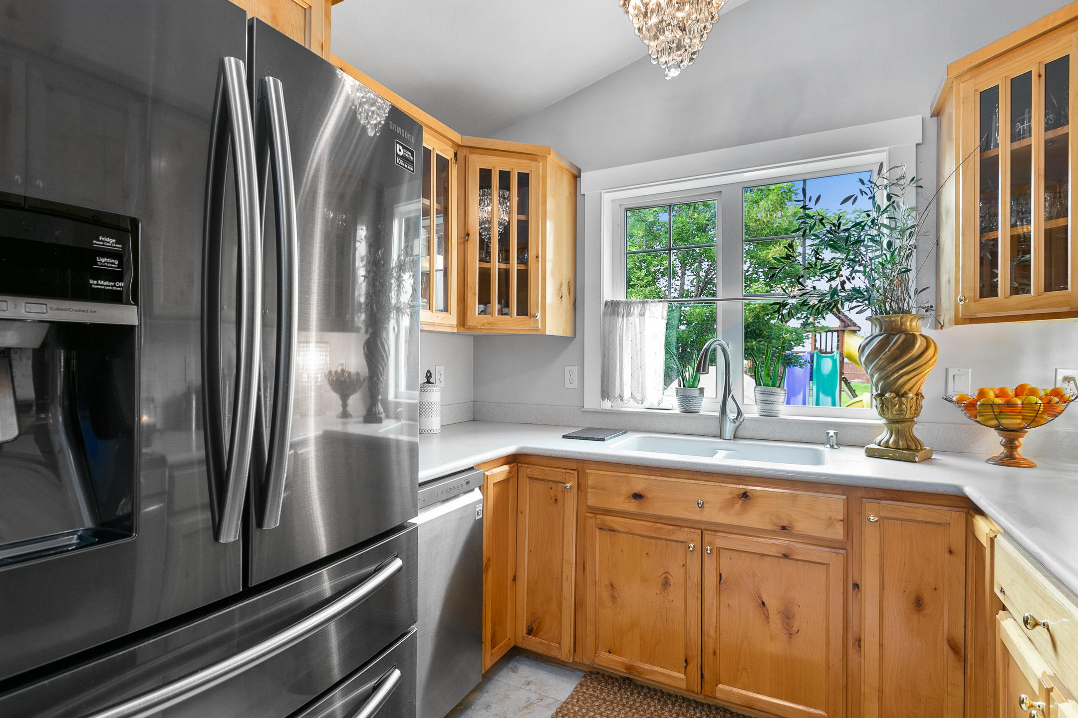 62672 Larkview Road Bend, OR 97701 - Photo 24 of 39 a kitchen with stainless steel appliances granite countertop a refrigerator and a sink
