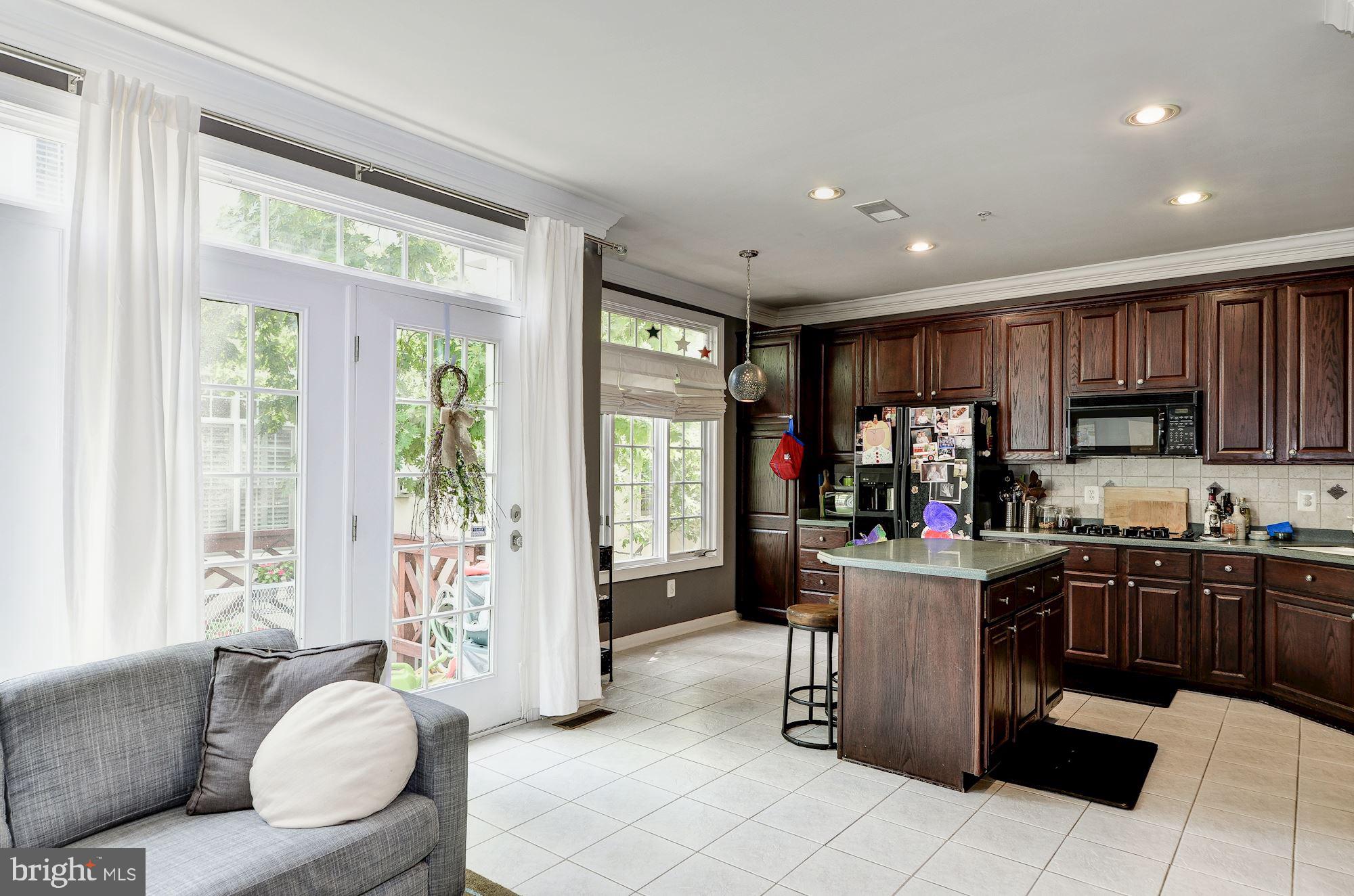 4908 Waple Lane Alexandria, VA 22304 - Photo 11 of 36 a living room with furniture and a large window