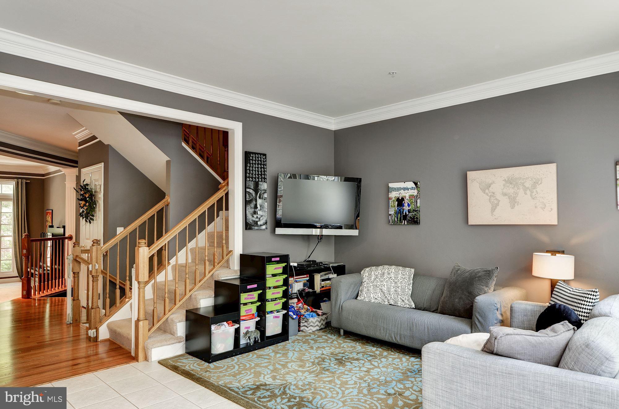 4908 Waple Lane Alexandria, VA 22304 - Photo 12 of 36 a living room with furniture and a flat screen tv