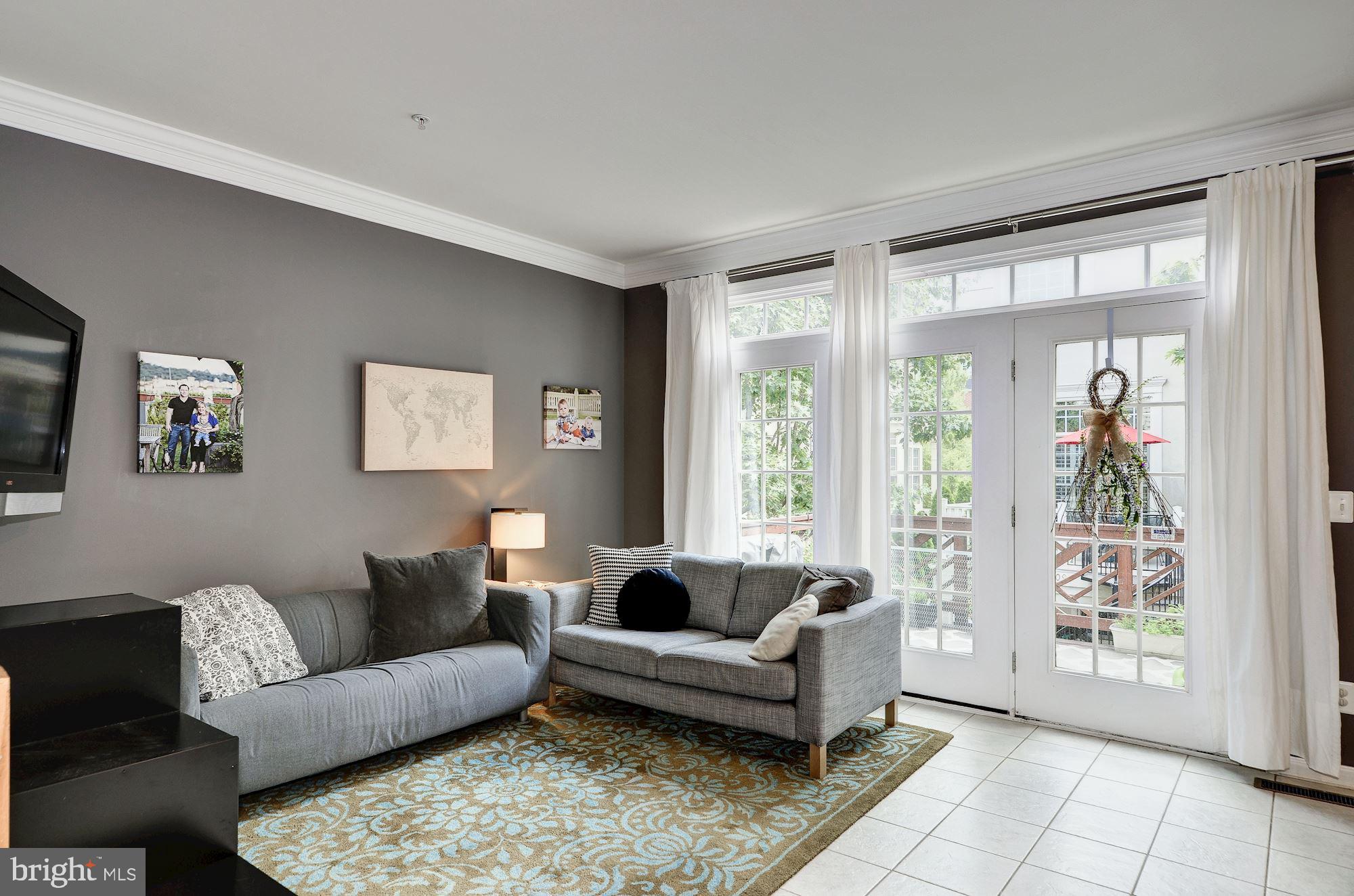 4908 Waple Lane Alexandria, VA 22304 - Photo 14 of 36 a living room with furniture and a large window