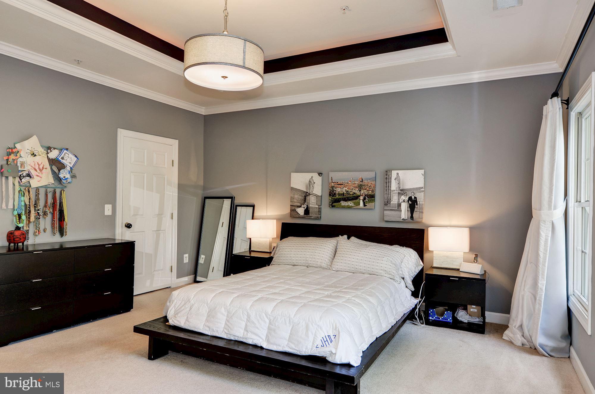 4908 Waple Lane Alexandria, VA 22304 - Photo 16 of 36 a bedroom with a bed and a night stand