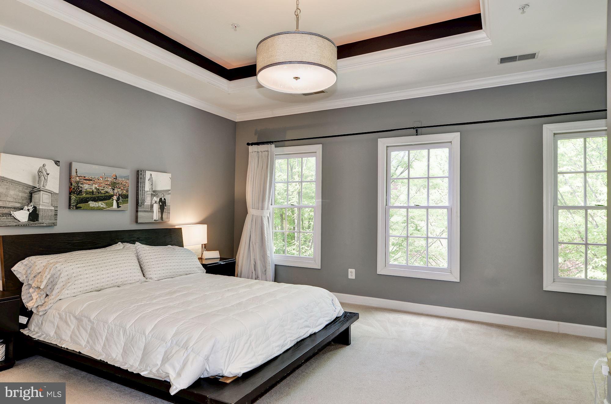 4908 Waple Lane Alexandria, VA 22304 - Photo 18 of 36 a bedroom with a large bed and a window