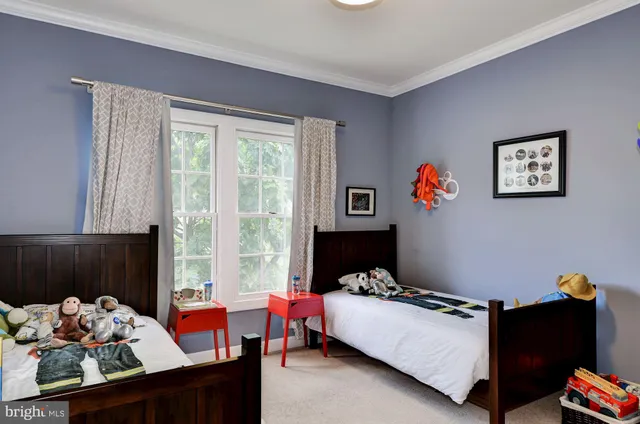 a bedroom with furniture and a window