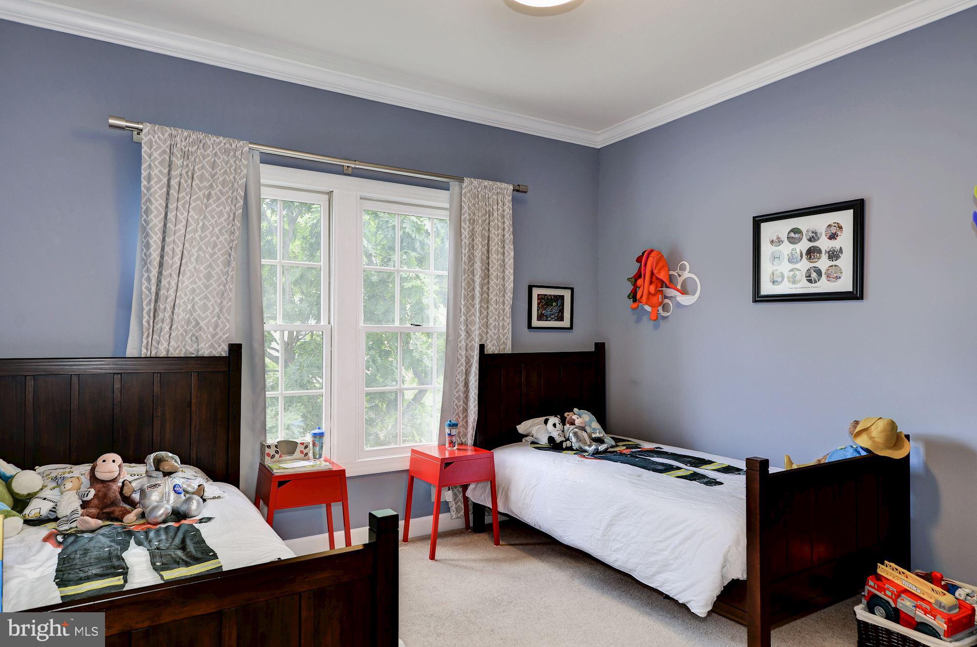 4908 Waple Lane Alexandria, VA 22304 - Photo 20 of 36 a bedroom with furniture and a window