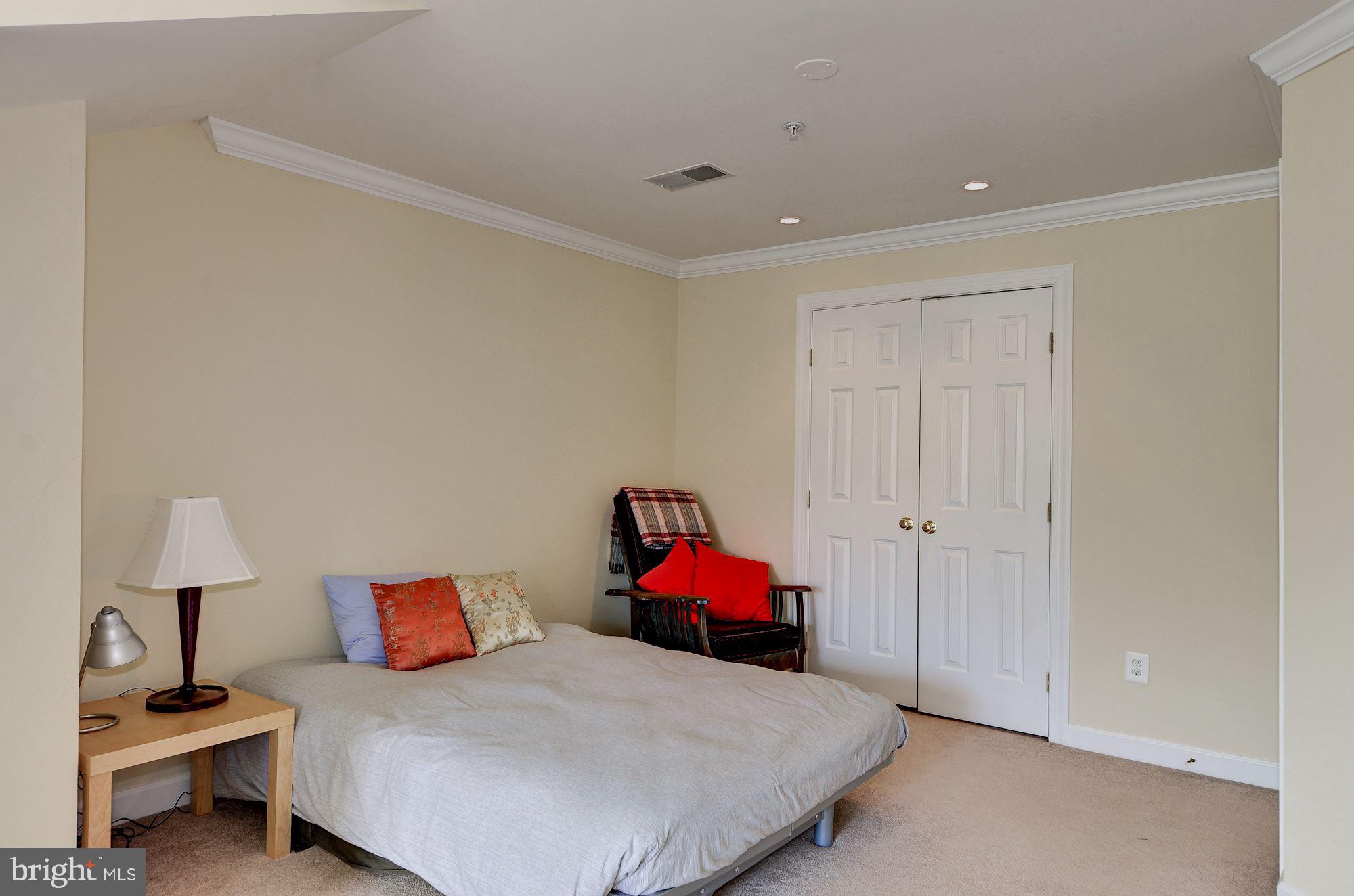4908 Waple Lane Alexandria, VA 22304 - Photo 23 of 36 a bedroom with a bed and a closet