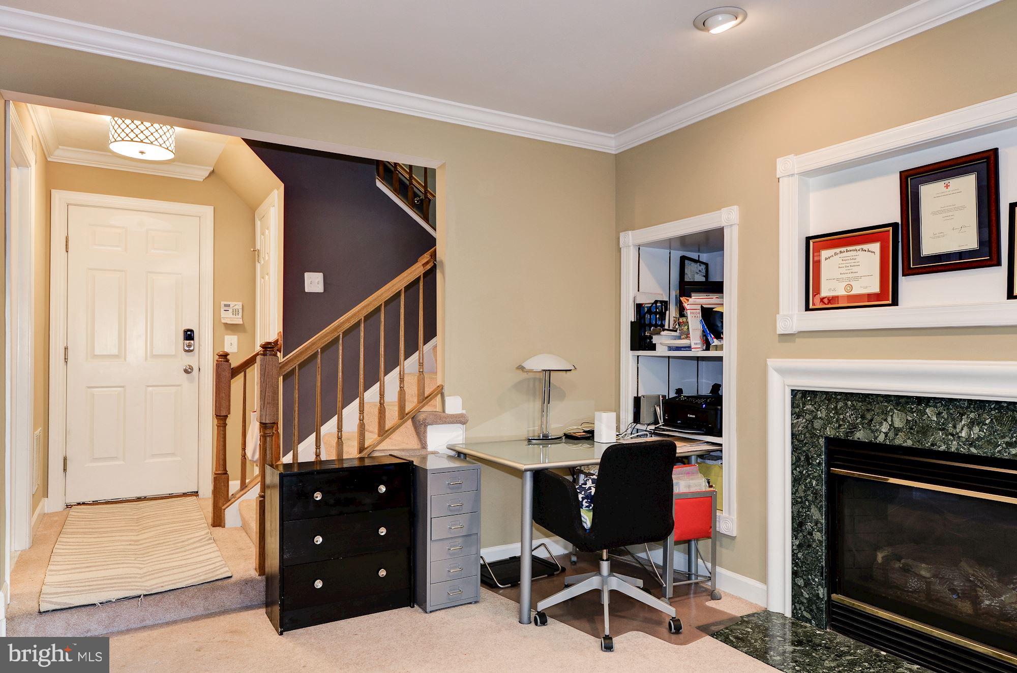 4908 Waple Lane Alexandria, VA 22304 - Photo 25 of 36 a living room with furniture and a fireplace
