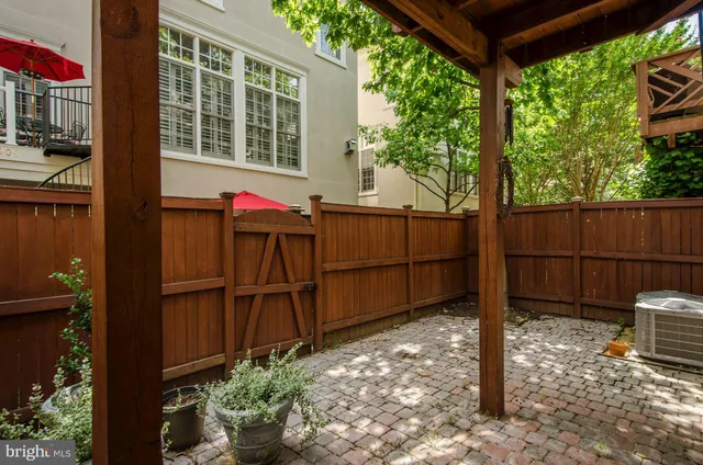 a view of a backyard with a tree