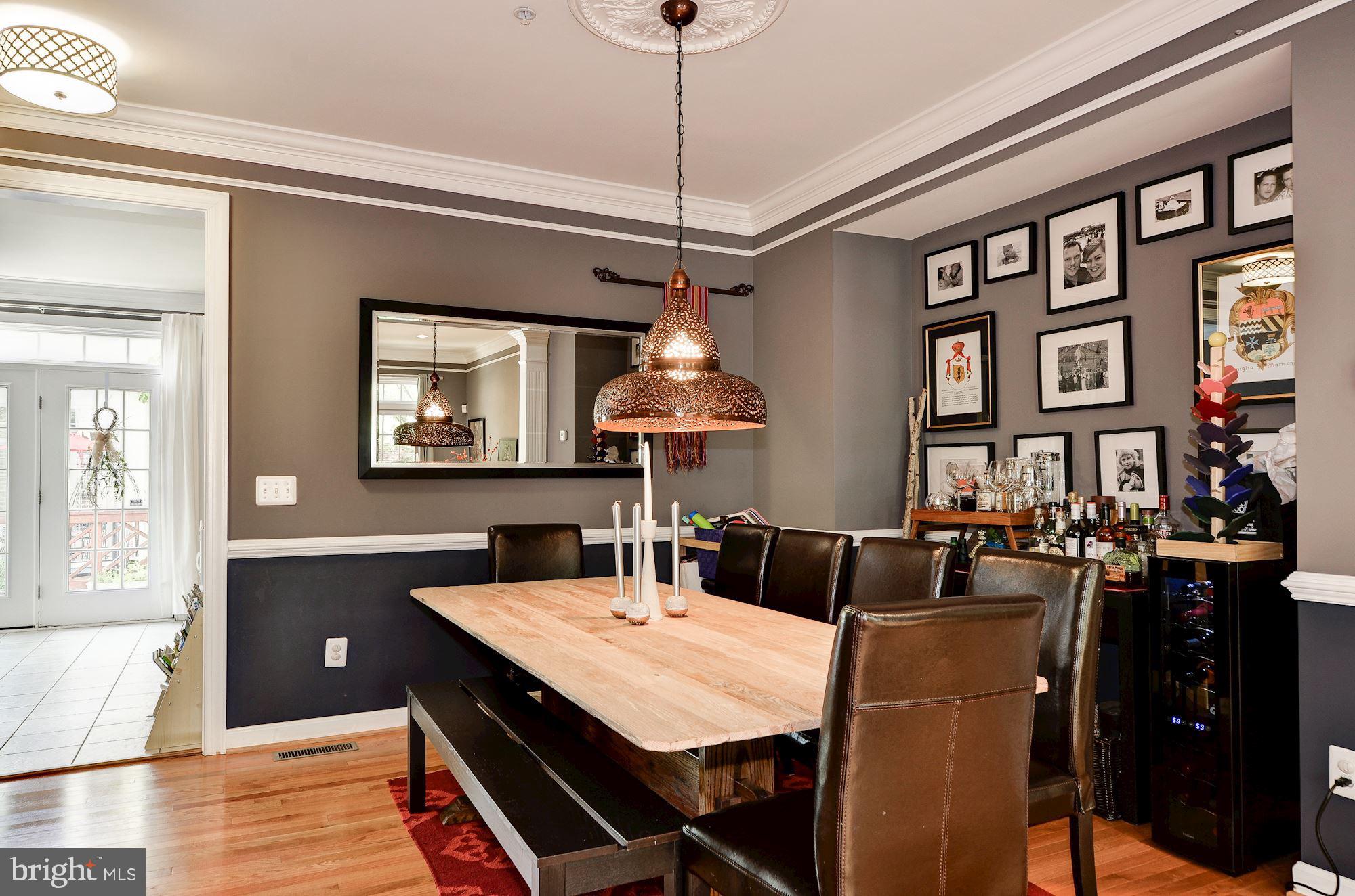 4908 Waple Lane Alexandria, VA 22304 - Photo 7 of 36 a view of a dining room with furniture window and wooden floor