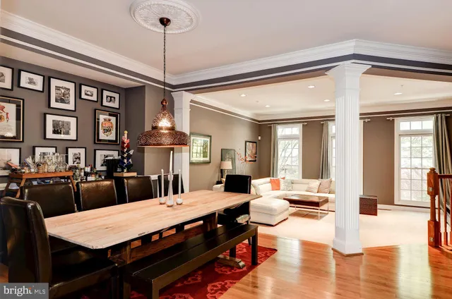 a large kitchen with a table and chairs