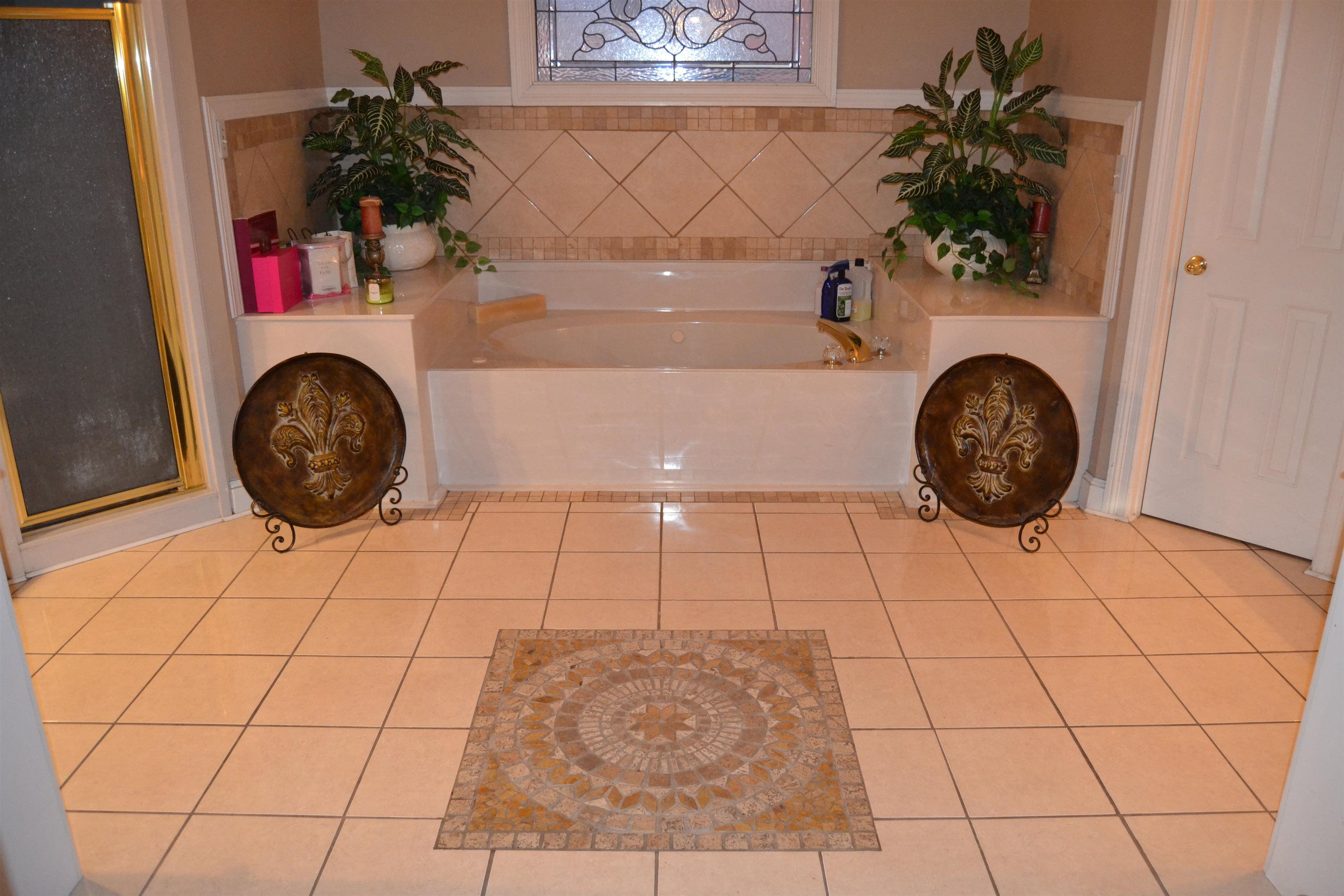 1364 Winoka Road Collierville, TN 38017 - Photo 16 of 25 a bathroom with a sink and a mirror